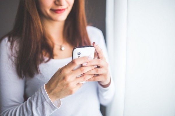 woman using her smartphone