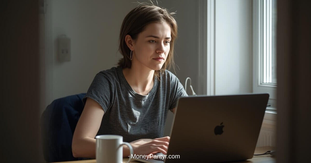 Woman working from home at a simple desk, focused on laptop — legit remote job in 2026