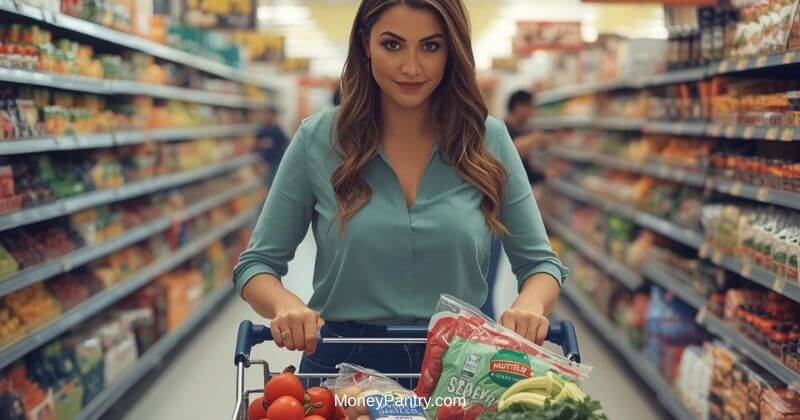 Grocery cart filled with EBT-eligible food items including fresh produce, dairy, and packaged goods